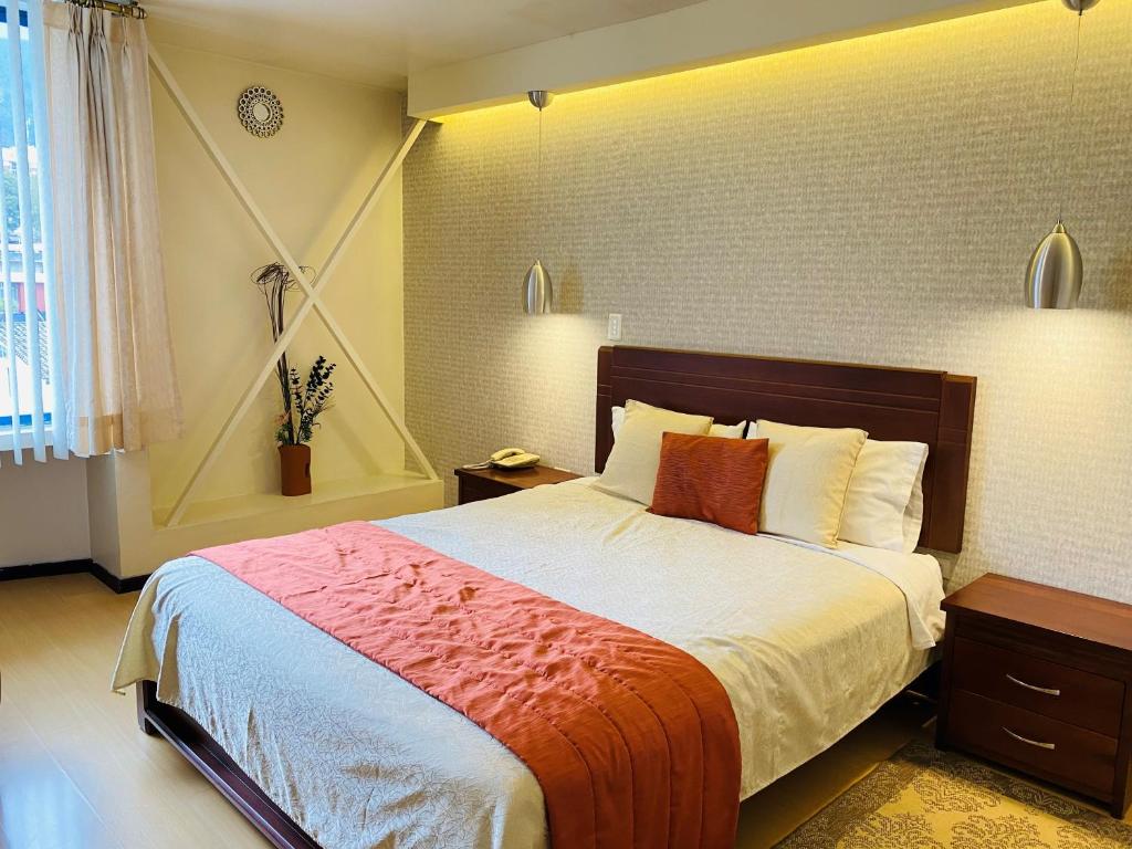 Postel nebo postele na pokoji v ubytování Suites Metropoli