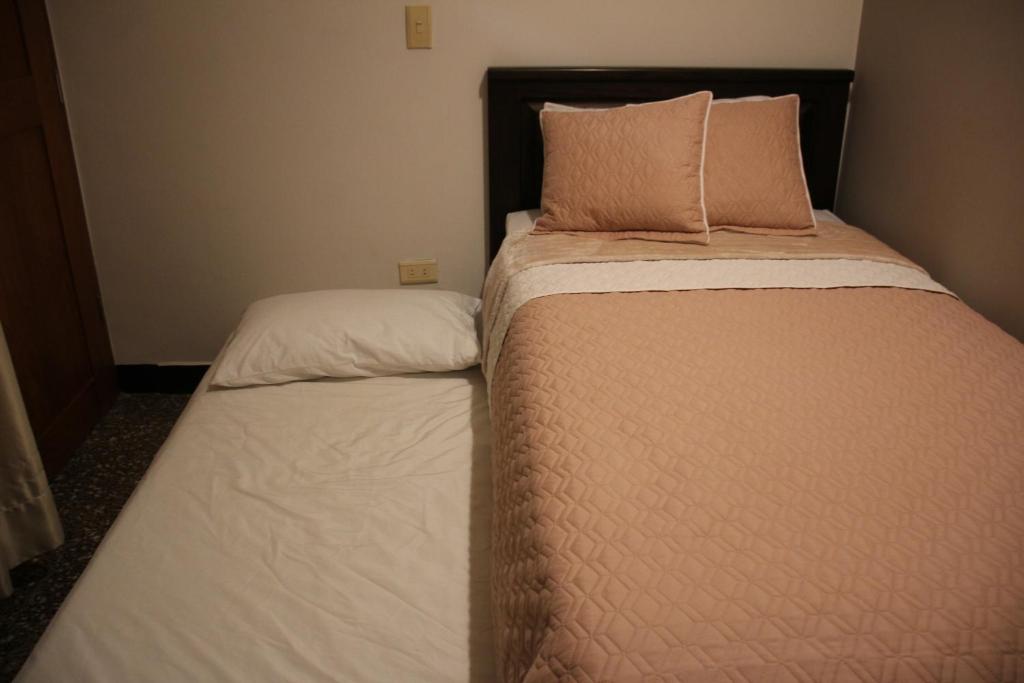 Postel nebo postele na pokoji v ubytování Hotel Plaza El Santuario