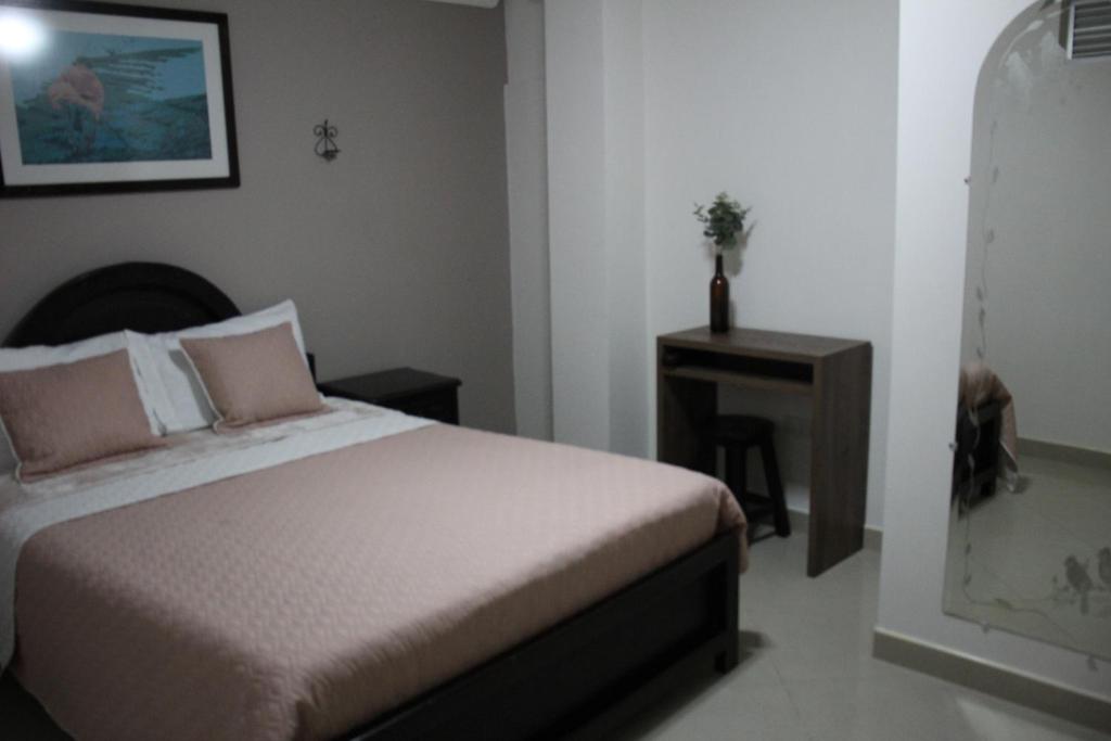 Postel nebo postele na pokoji v ubytování Hotel Plaza El Santuario