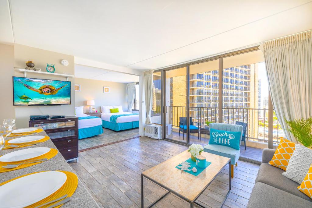 a large living room with a couch and a bed at Aloha Vibes, Ocean & City Views with Free Parking! in Honolulu