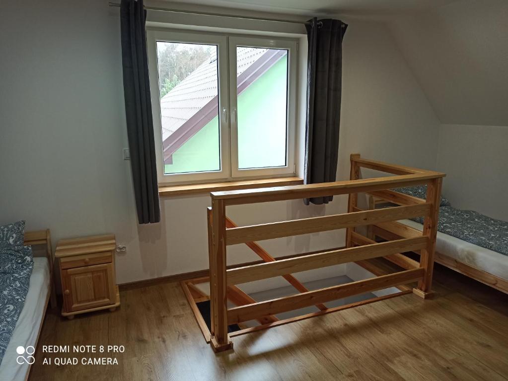 Posteľ alebo postele v izbe v ubytovaní Apartameny Wiktoria i Nikola w Karwiku