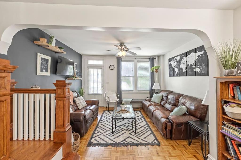 a living room with a couch and a table at Rare City Home w/ Backyard Fire-pit & Hottub in Lancaster