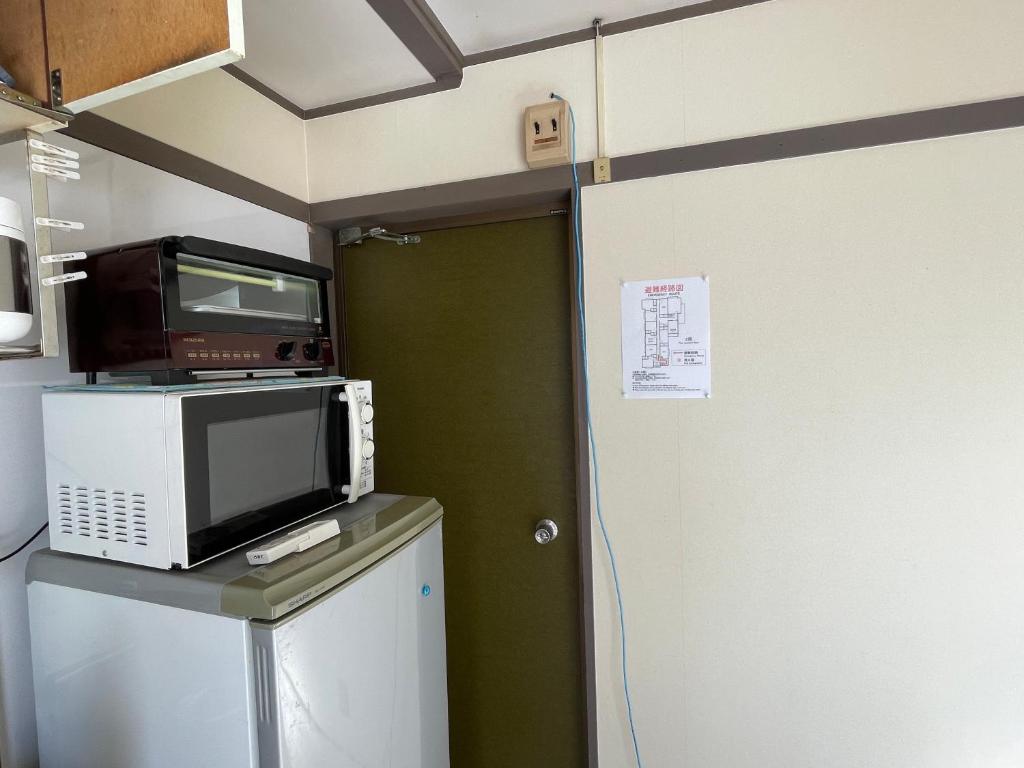Kuchyň nebo kuchyňský kout v ubytování Kyoto Wakouan Retro Stay