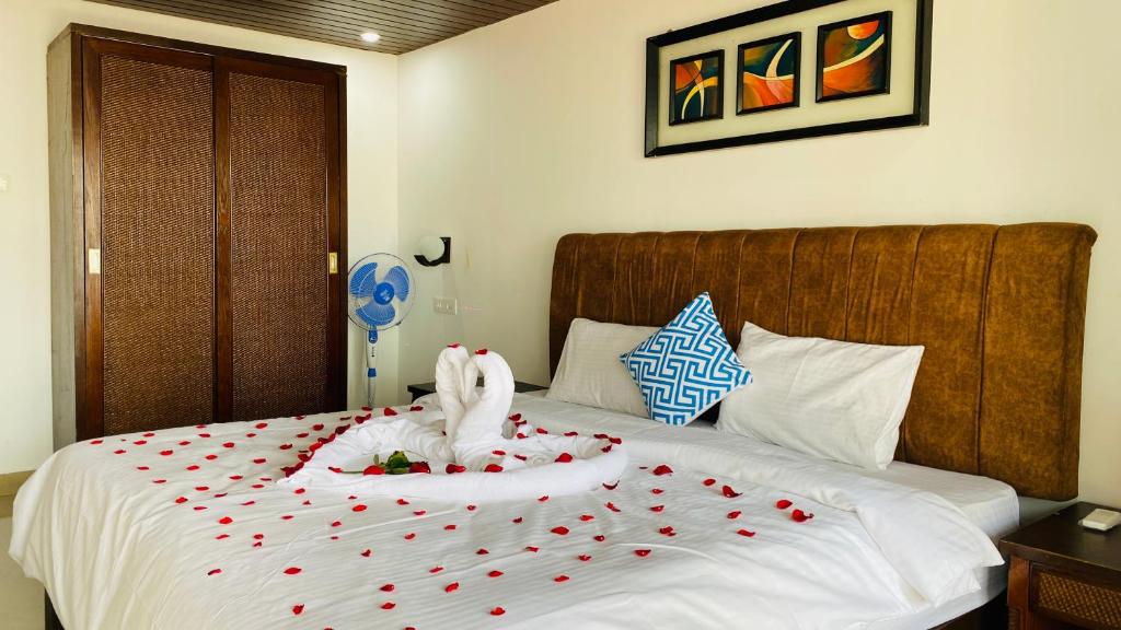 Ένα ή περισσότερα κρεβάτια σε δωμάτιο στο Grand Sea Shades Goa