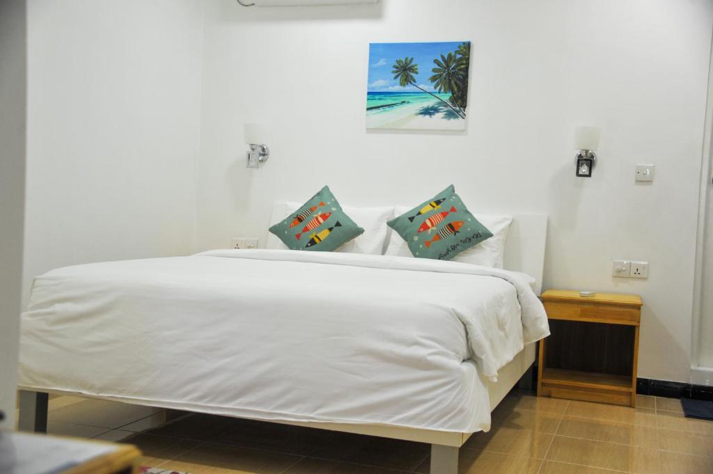 Postel nebo postele na pokoji v ubytování Asseyri Guest House