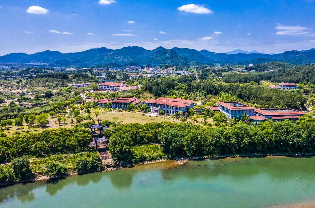 an aerial view of a city and a lake at Dahongpao Resort in Wuyishan