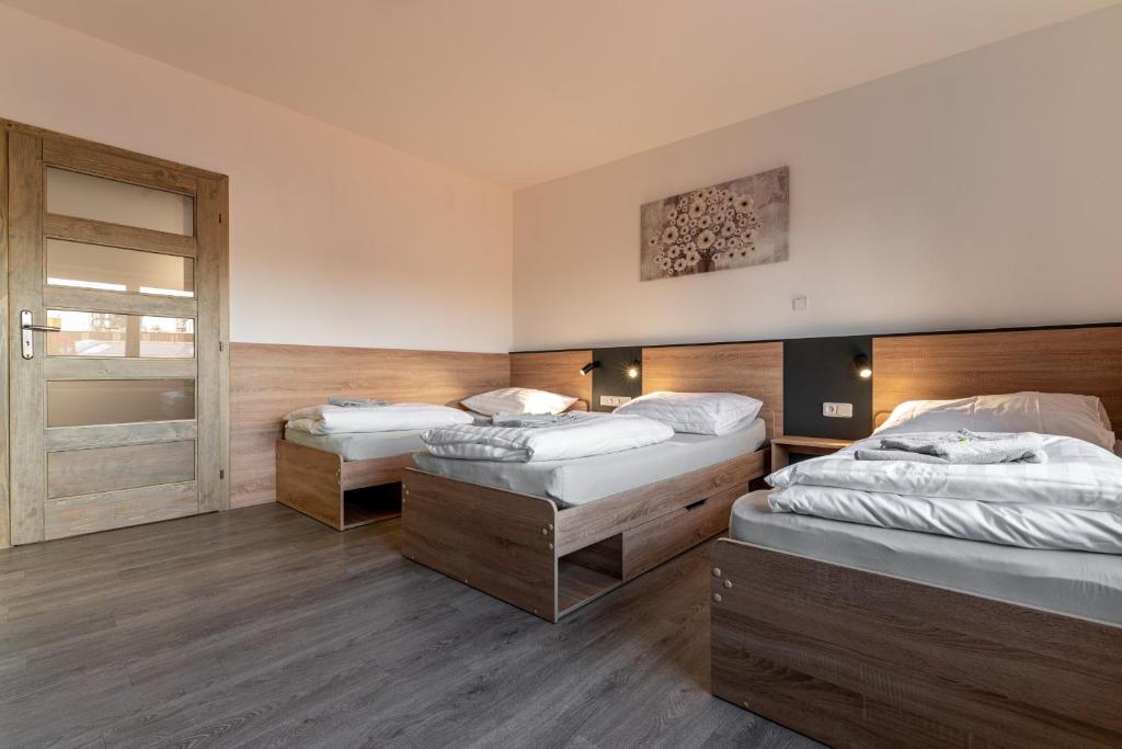 Postel nebo postele na pokoji v ubytování Apartmány Lucie