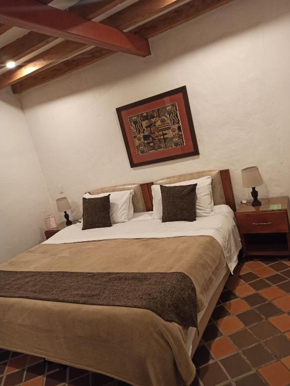 Postel nebo postele na pokoji v ubytování HOTEL LA POSADA DEL ZAGUÁN