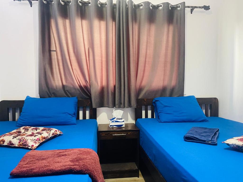 Кровать или кровати в номере Elite Residence Dahab