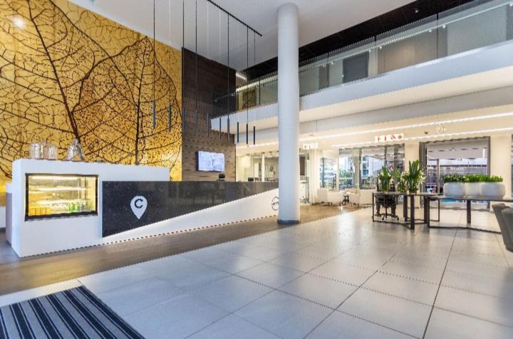 a lobby of a shopping center with a large building at Menlyn Maine Trilogy Apartment 1010 in Pretoria