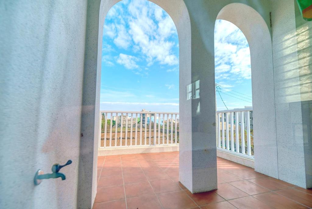 Balkón nebo terasa v ubytování Island Arch Homestay