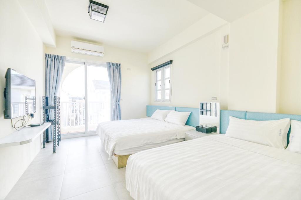Postel nebo postele na pokoji v ubytování Island Arch Homestay