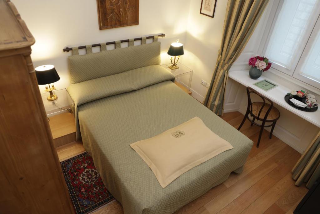 Postel nebo postele na pokoji v ubytování Residenza Le 6 A