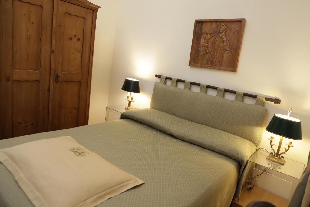 Postel nebo postele na pokoji v ubytování Residenza Le 6 A