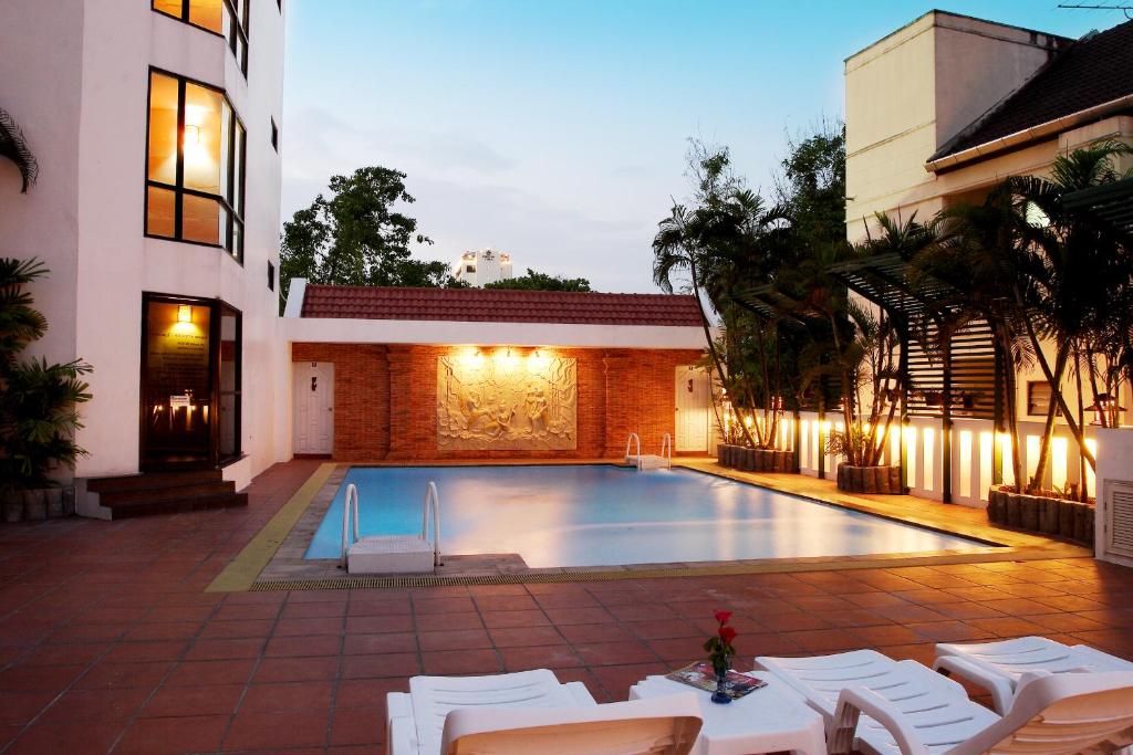 a swimming pool in the backyard of a house at CH Hotel in Chiang Mai
