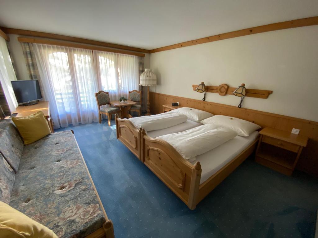 Postel nebo postele na pokoji v ubytování Hotel B&B Casa La Val