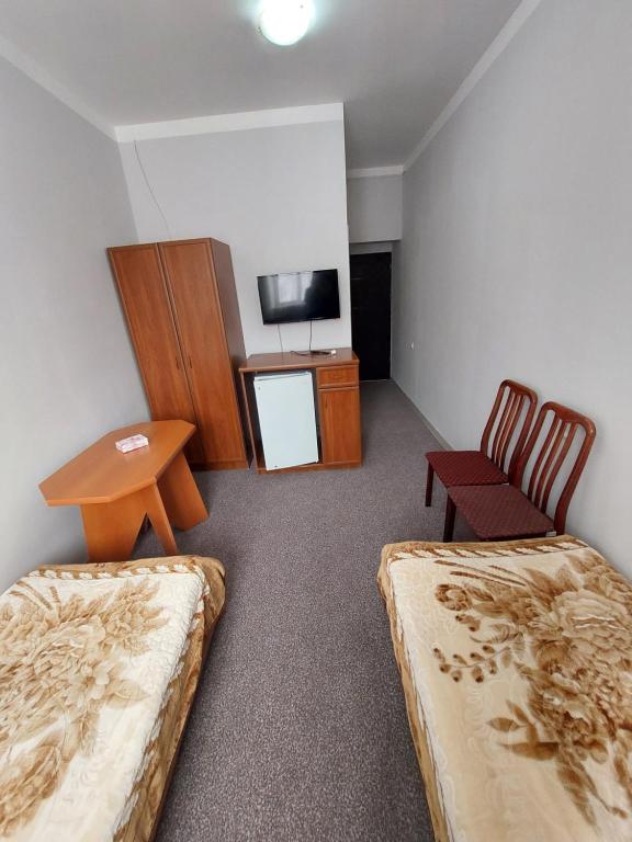 Postel nebo postele na pokoji v ubytování University Hotel Tsakhkadzor