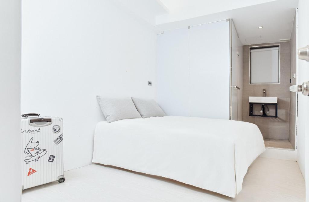 Postel nebo postele na pokoji v ubytování White Space Design Hotel
