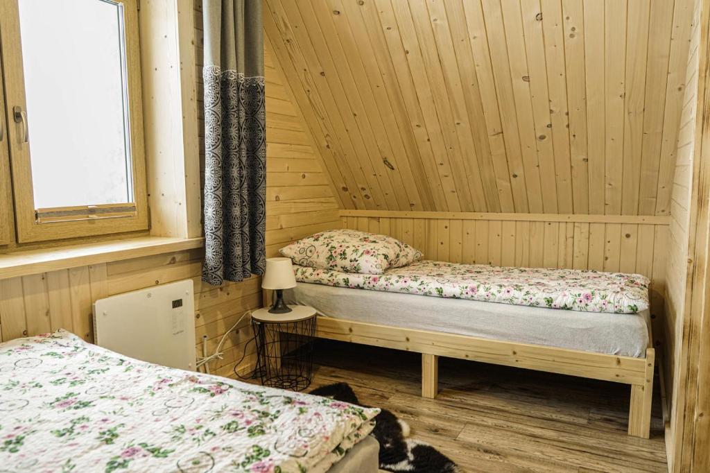 Posteľ alebo postele v izbe v ubytovaní Domek na Zrąbku Pod Gubałówką