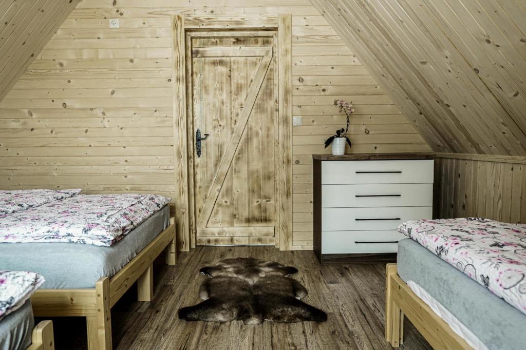 Posteľ alebo postele v izbe v ubytovaní Domek na Zrąbku Pod Gubałówką