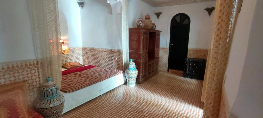 Postel nebo postele na pokoji v ubytování Riad Ifoulki