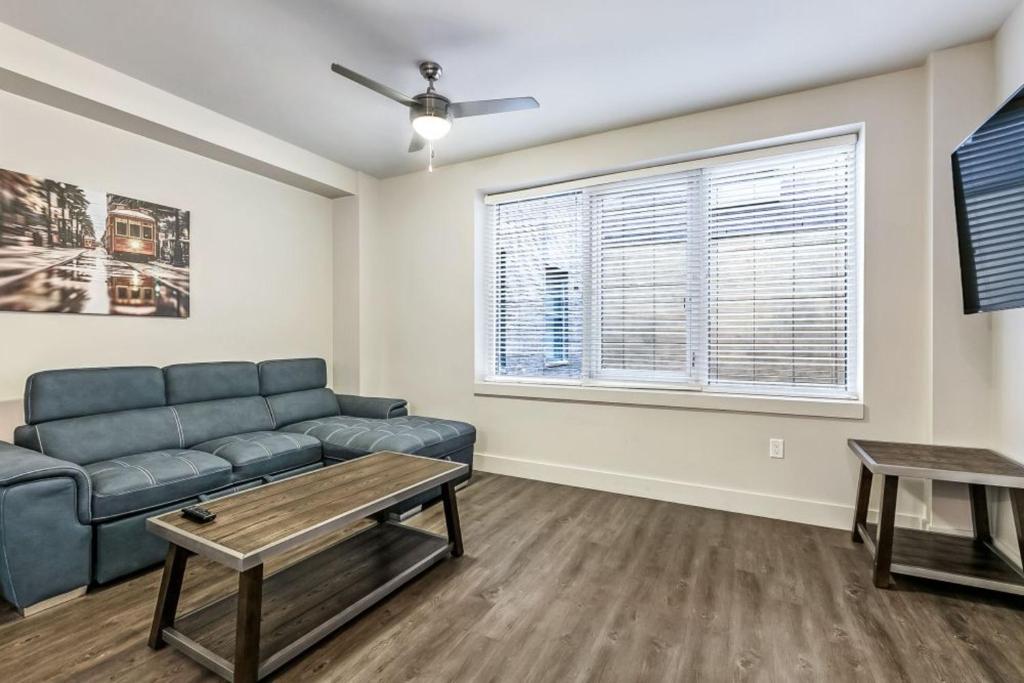 a living room with a couch and a table at Stylish Condo Walking Distance to Local Attractions of New Orleans in New Orleans