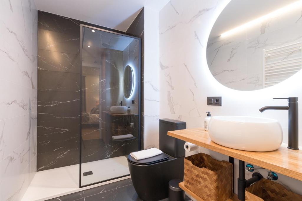 a bathroom with a sink and a shower at Arriaga in Bilbao