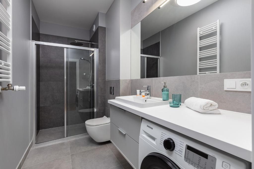 Kúpeľňa v ubytovaní Baltic Marina Residence Sauna & Fitness Apartments by Noclegi Renters