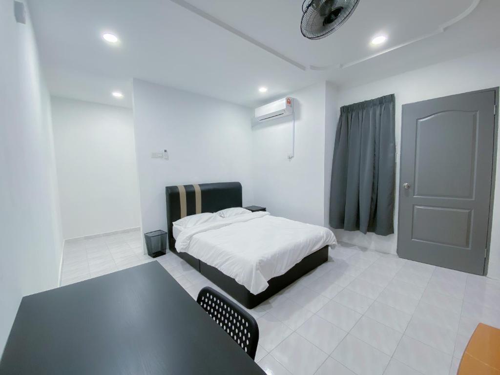 Voodi või voodid majutusasutuse Venice Guest Hostel - Bilik Sahaja toas