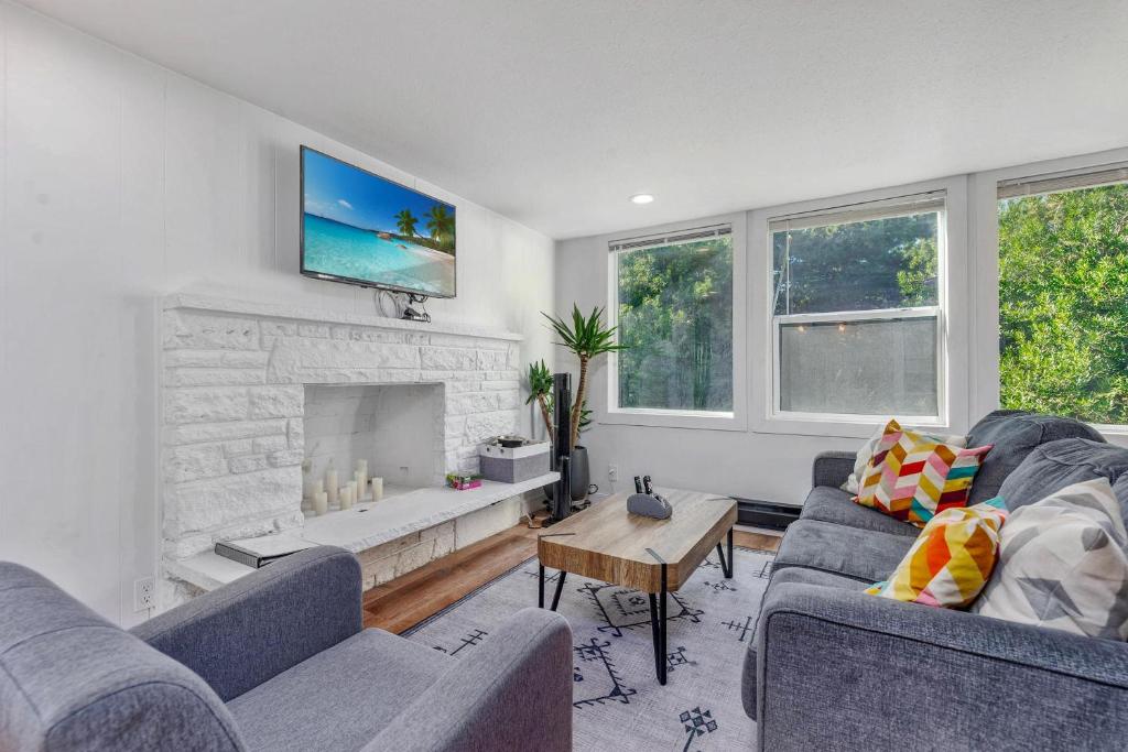 a living room with two couches and a fireplace at Tidal House 5 in Ocean Shores