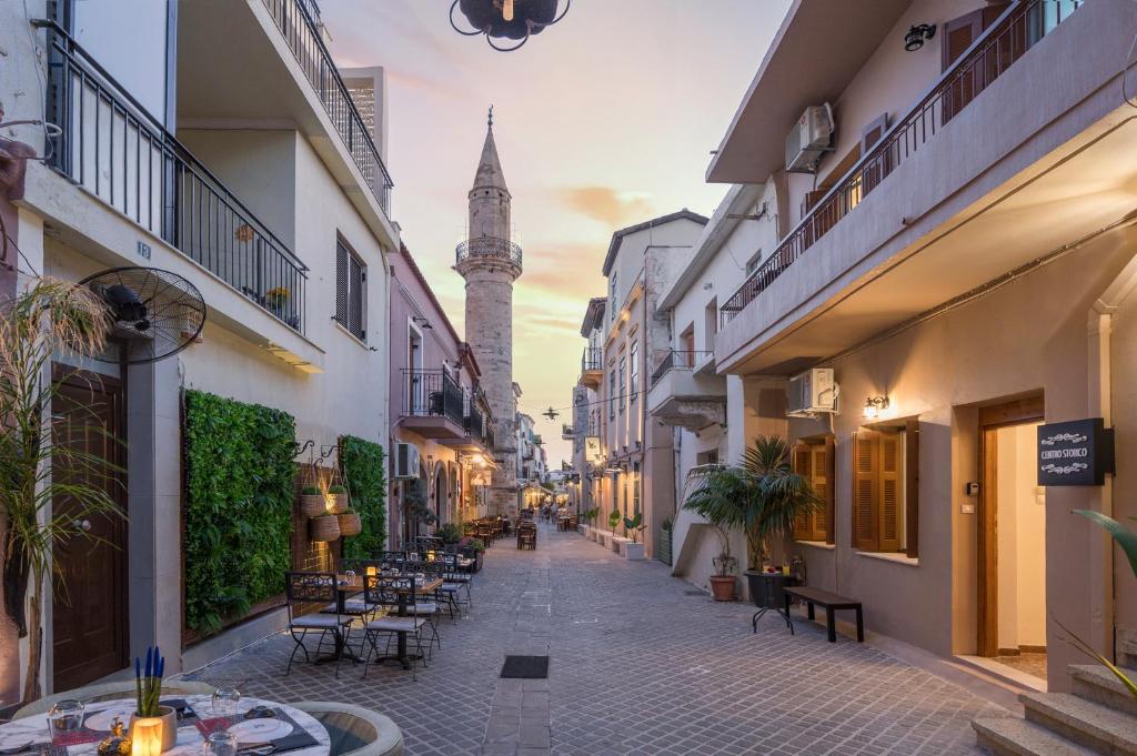a street with a clock tower in the distance at Centro Storico in Chania