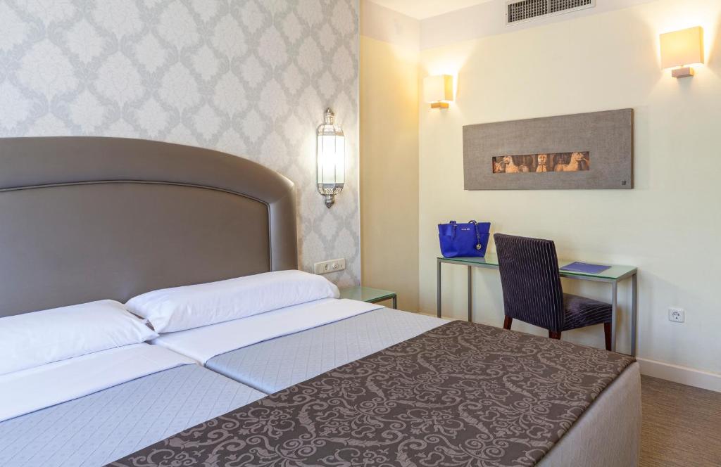 Postel nebo postele na pokoji v ubytování Hotel Macià Alfaros