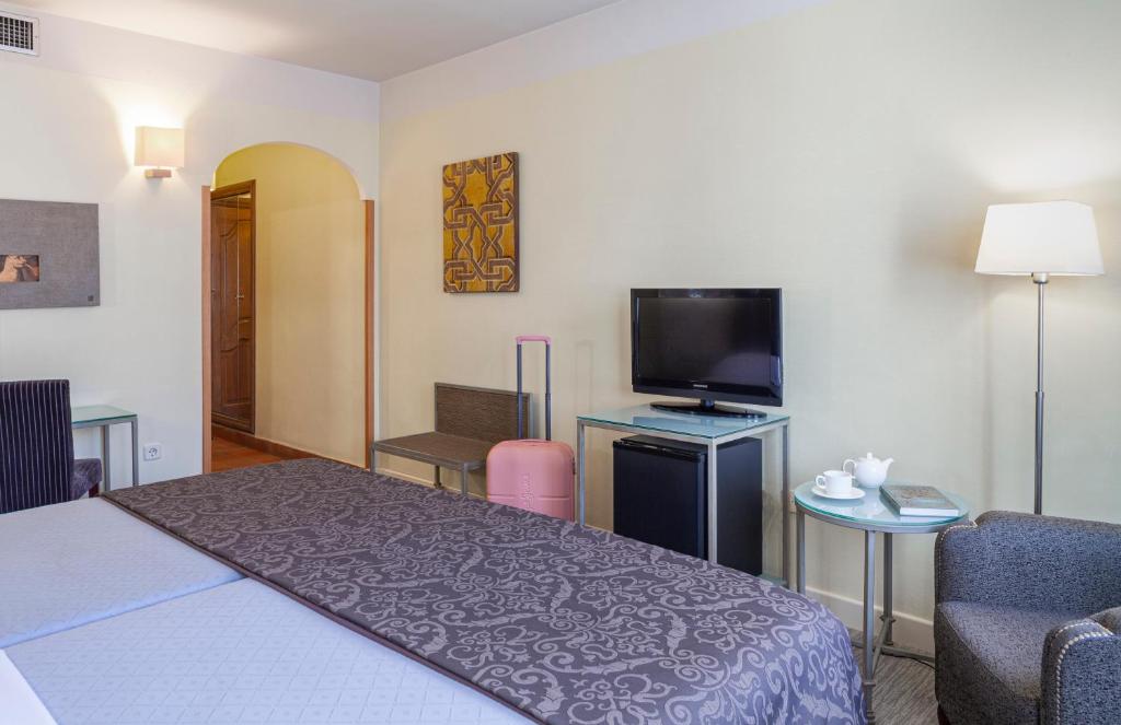 Postel nebo postele na pokoji v ubytování Hotel Macià Alfaros