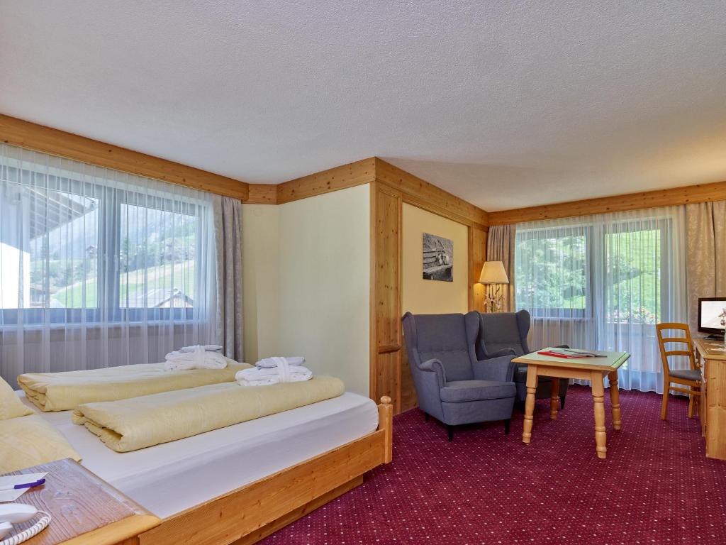 Postel nebo postele na pokoji v ubytování Hotel Erhart Sölden