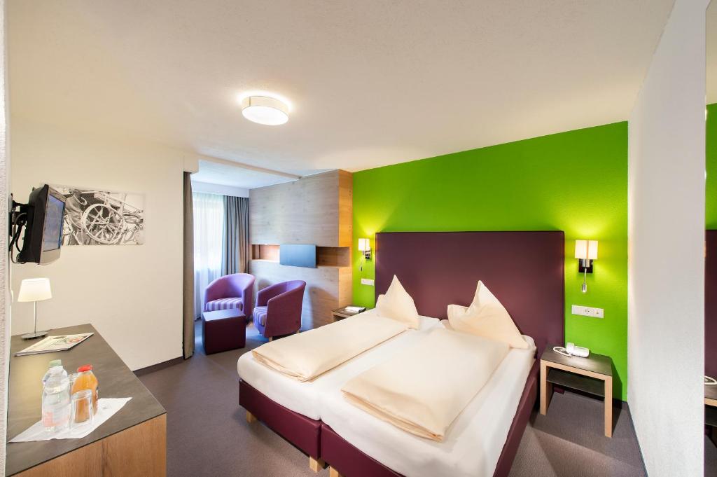 Postel nebo postele na pokoji v ubytování Hotel Erhart Sölden