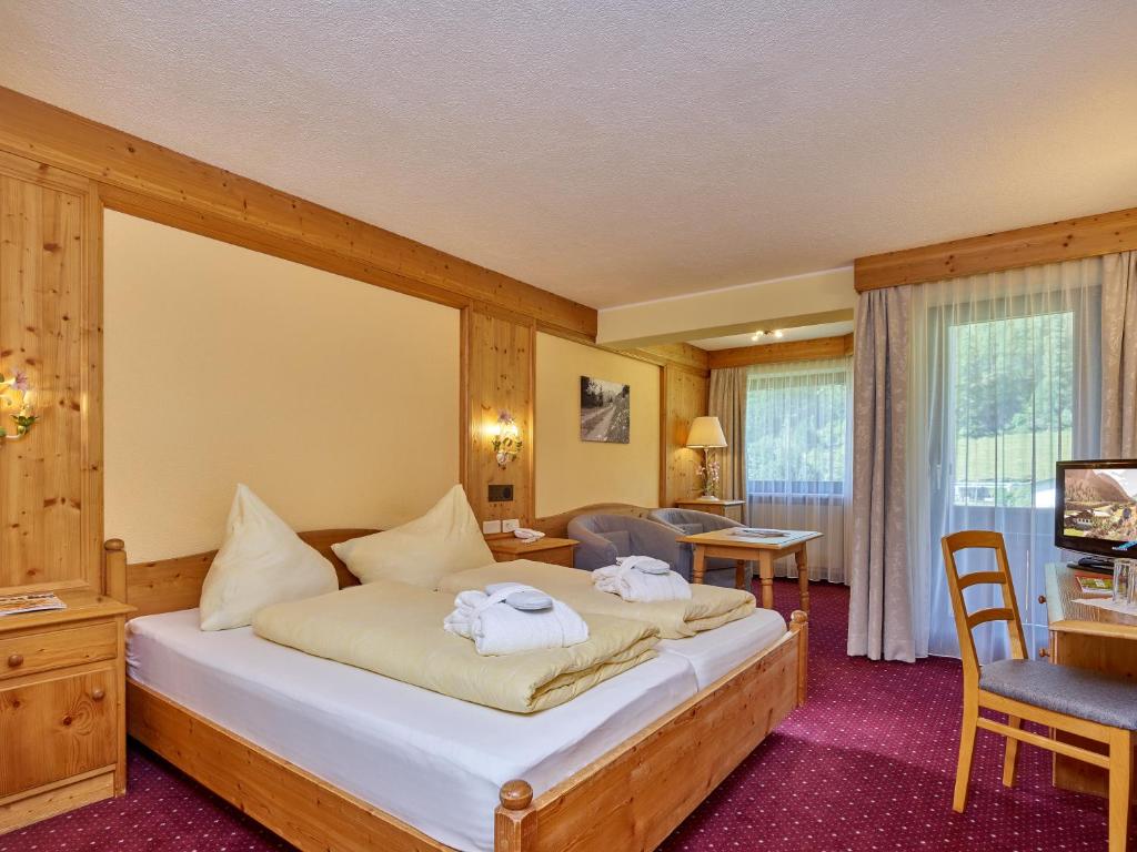 Postel nebo postele na pokoji v ubytování Hotel Erhart Sölden