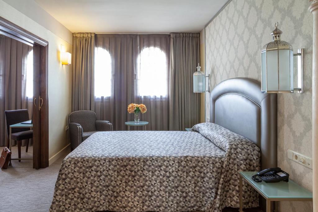 Postel nebo postele na pokoji v ubytování Hotel Macià Alfaros