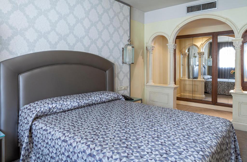 Postel nebo postele na pokoji v ubytování Hotel Macià Alfaros