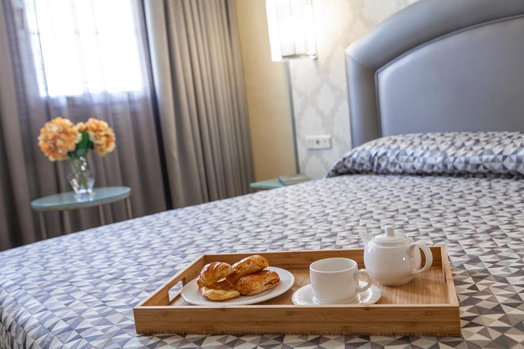 Postel nebo postele na pokoji v ubytování Hotel Macià Alfaros