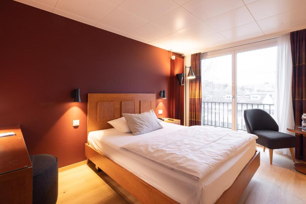 Postel nebo postele na pokoji v ubytování Engimatt City & Garden Hotel