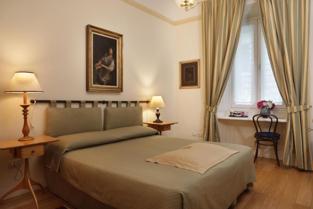 Postel nebo postele na pokoji v ubytování Residenza Le 6 A