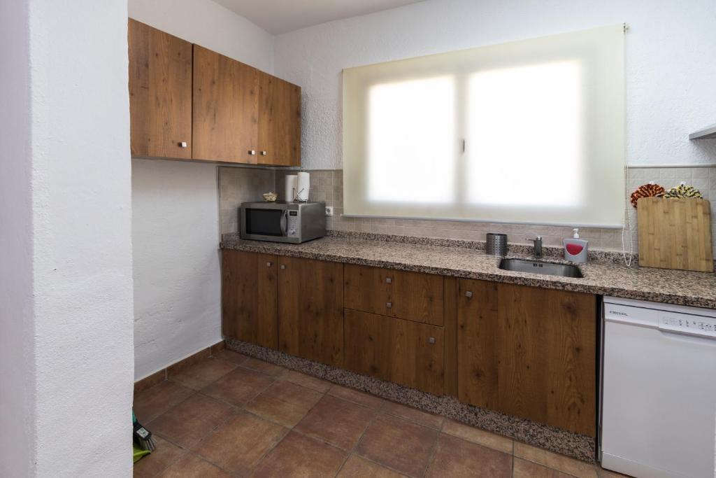 Kuchyň nebo kuchyňský kout v ubytování Apartamentos Cedro Alto