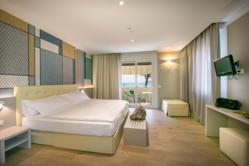 Postel nebo postele na pokoji v ubytování Hotel Le Lampare