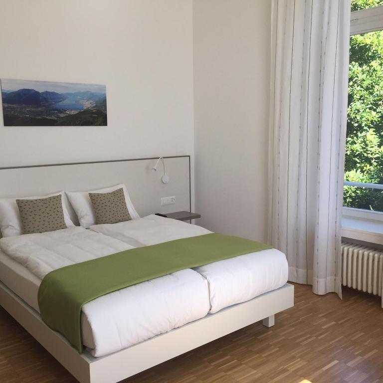 Postel nebo postele na pokoji v ubytování Business Center IN Villa