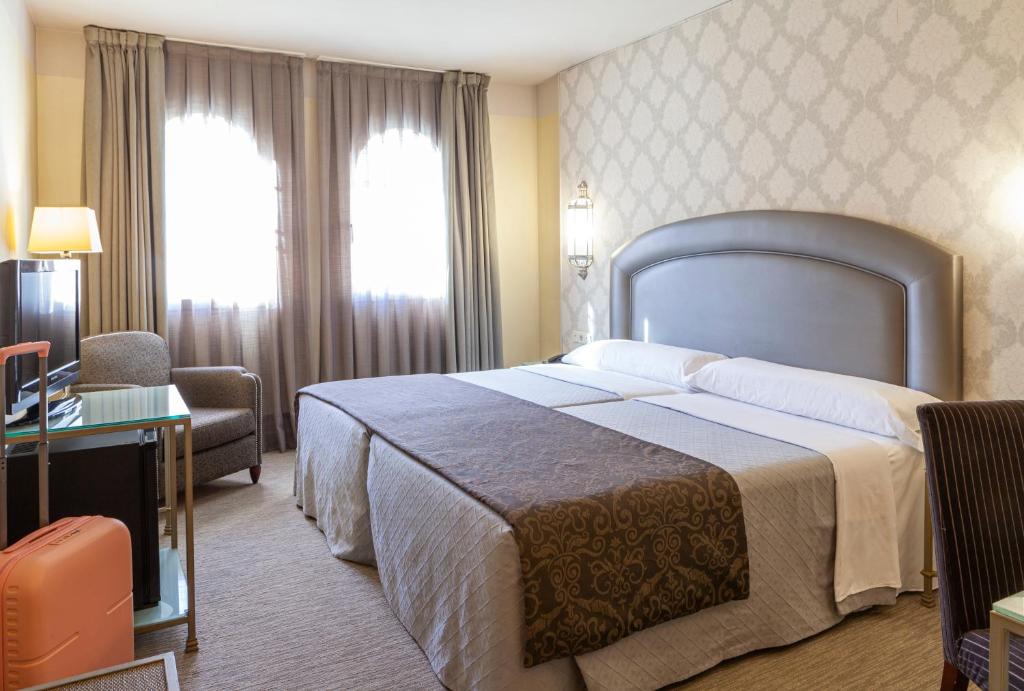 Postel nebo postele na pokoji v ubytování Hotel Macià Alfaros