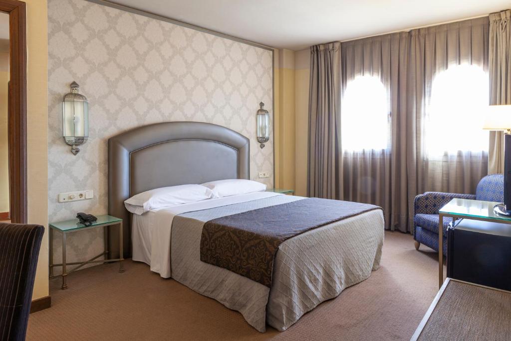 Postel nebo postele na pokoji v ubytování Hotel Macià Alfaros