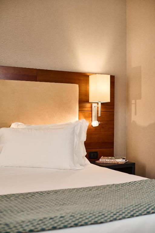 Postel nebo postele na pokoji v ubytování Hotel Da Vinci