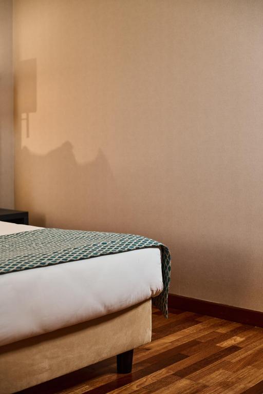 Postel nebo postele na pokoji v ubytování Hotel Da Vinci