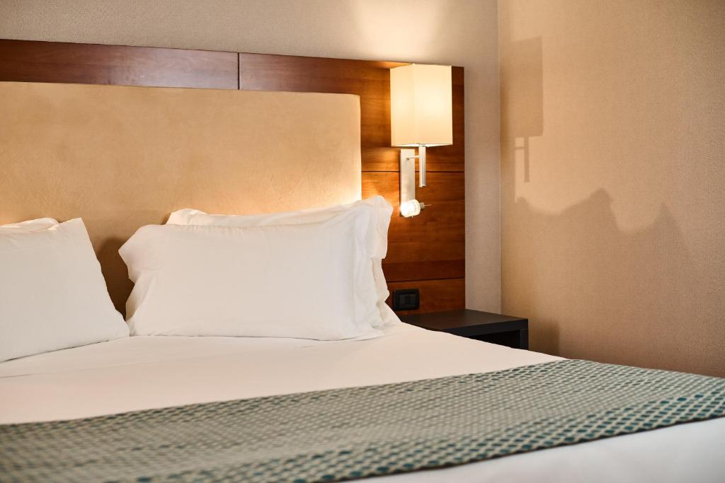 Postel nebo postele na pokoji v ubytování Hotel Da Vinci