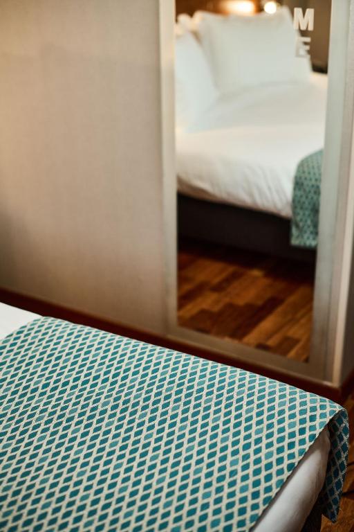Postel nebo postele na pokoji v ubytování Hotel Da Vinci